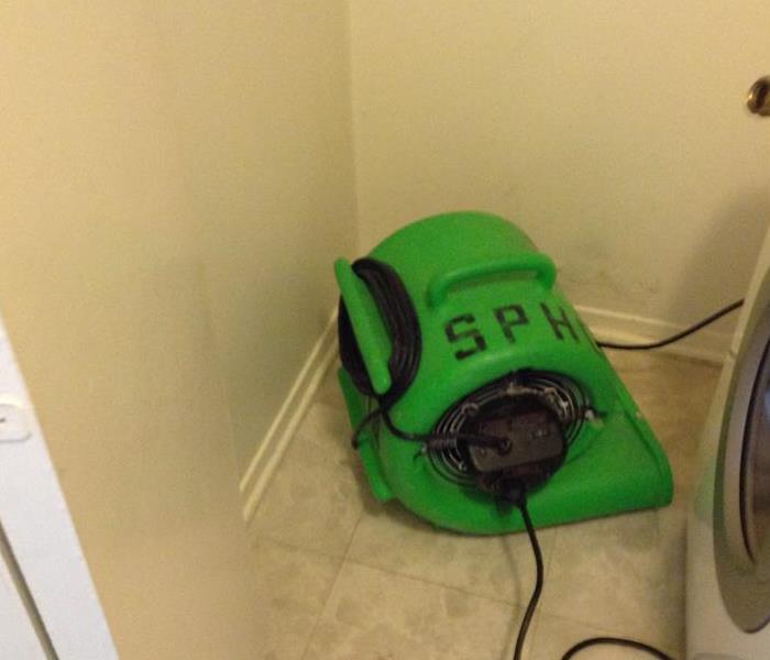 SERVPRO air mover in corner of room